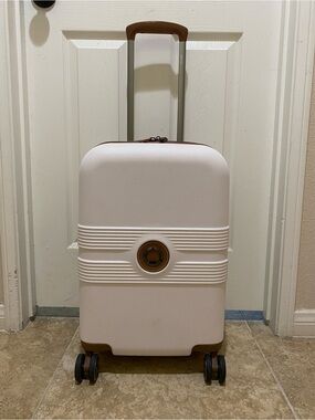 Delsey Paris white Carry-On Spinner Luggage with Tan Accents